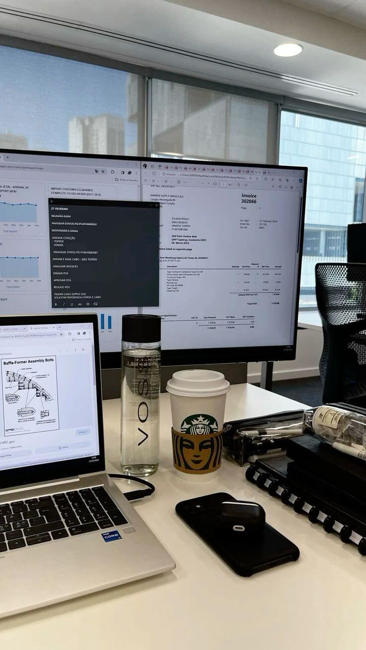 Executive holding smartphone displaying live revenue analytics dashboard